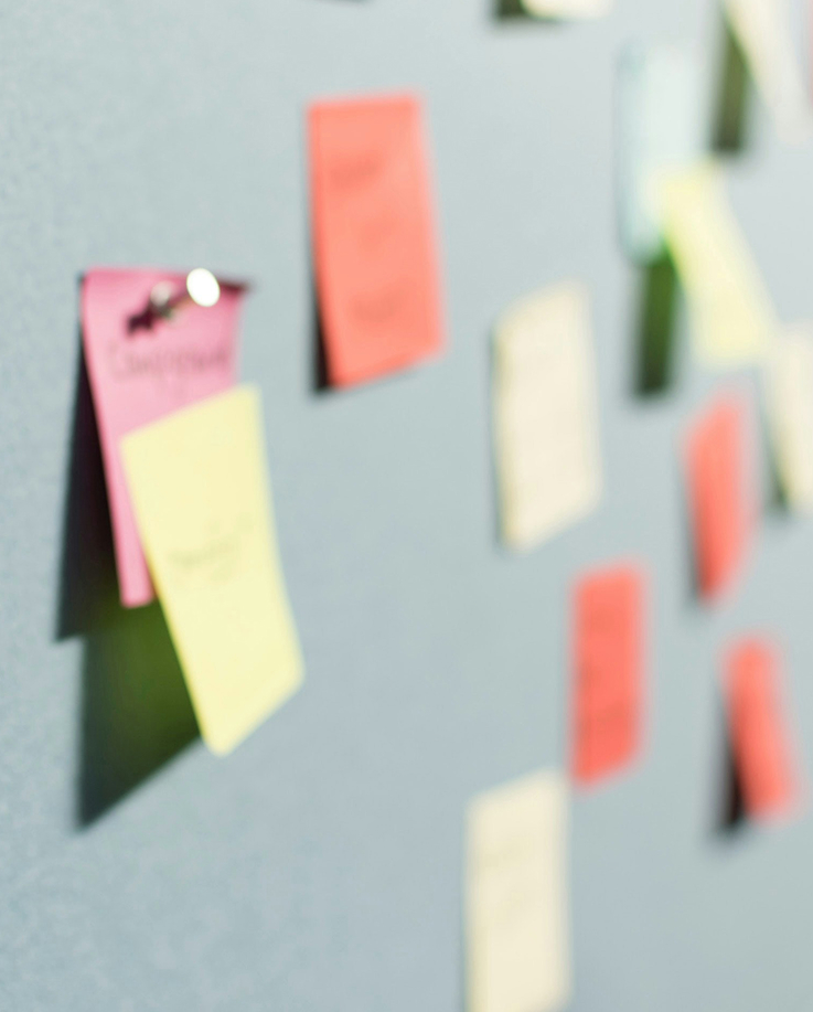 Sticky notes pinned to a wall